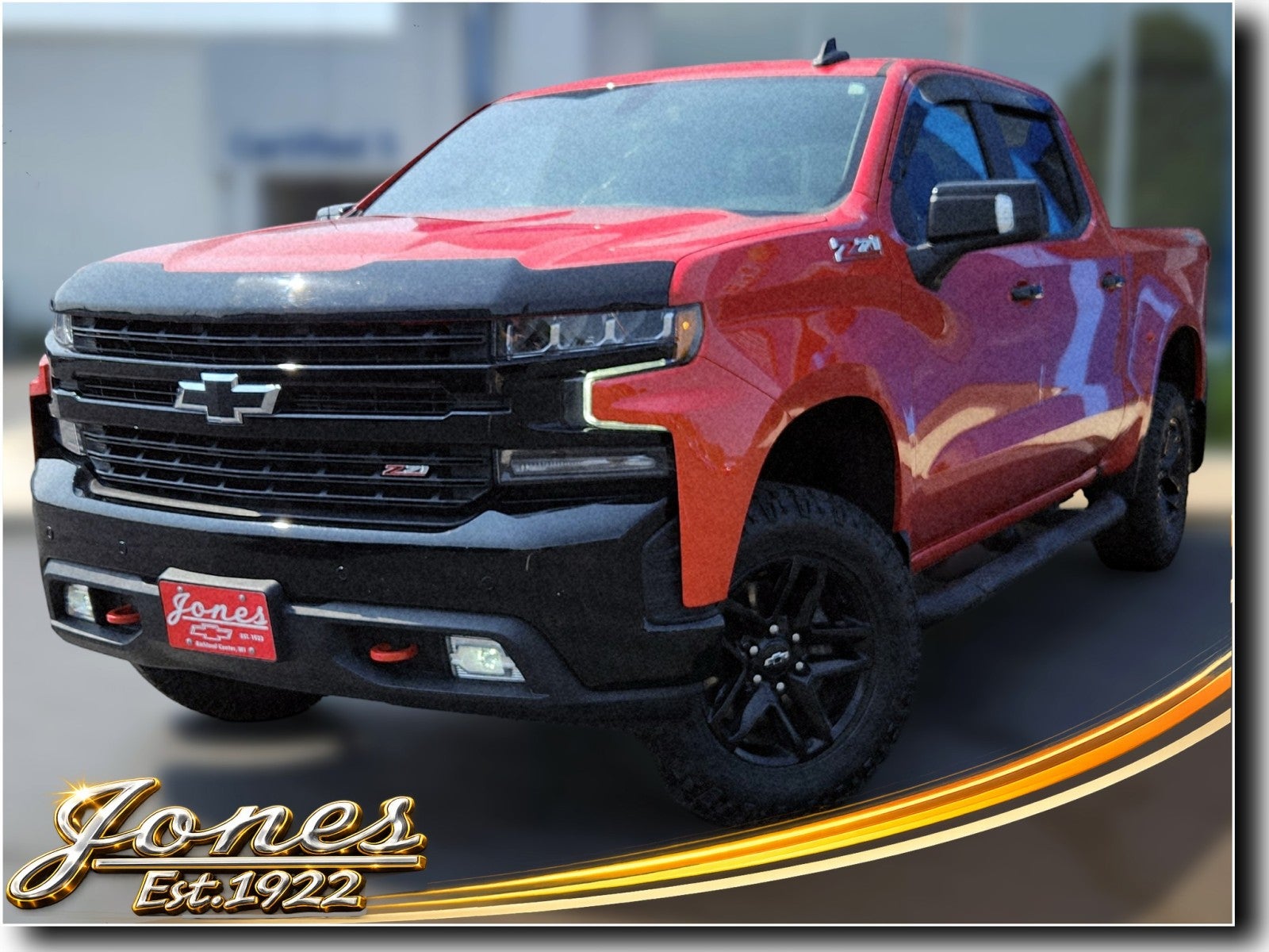 2022 Chevrolet Silverado 1500 LTD LT Trail Boss in Red Hot — front three-quarter view