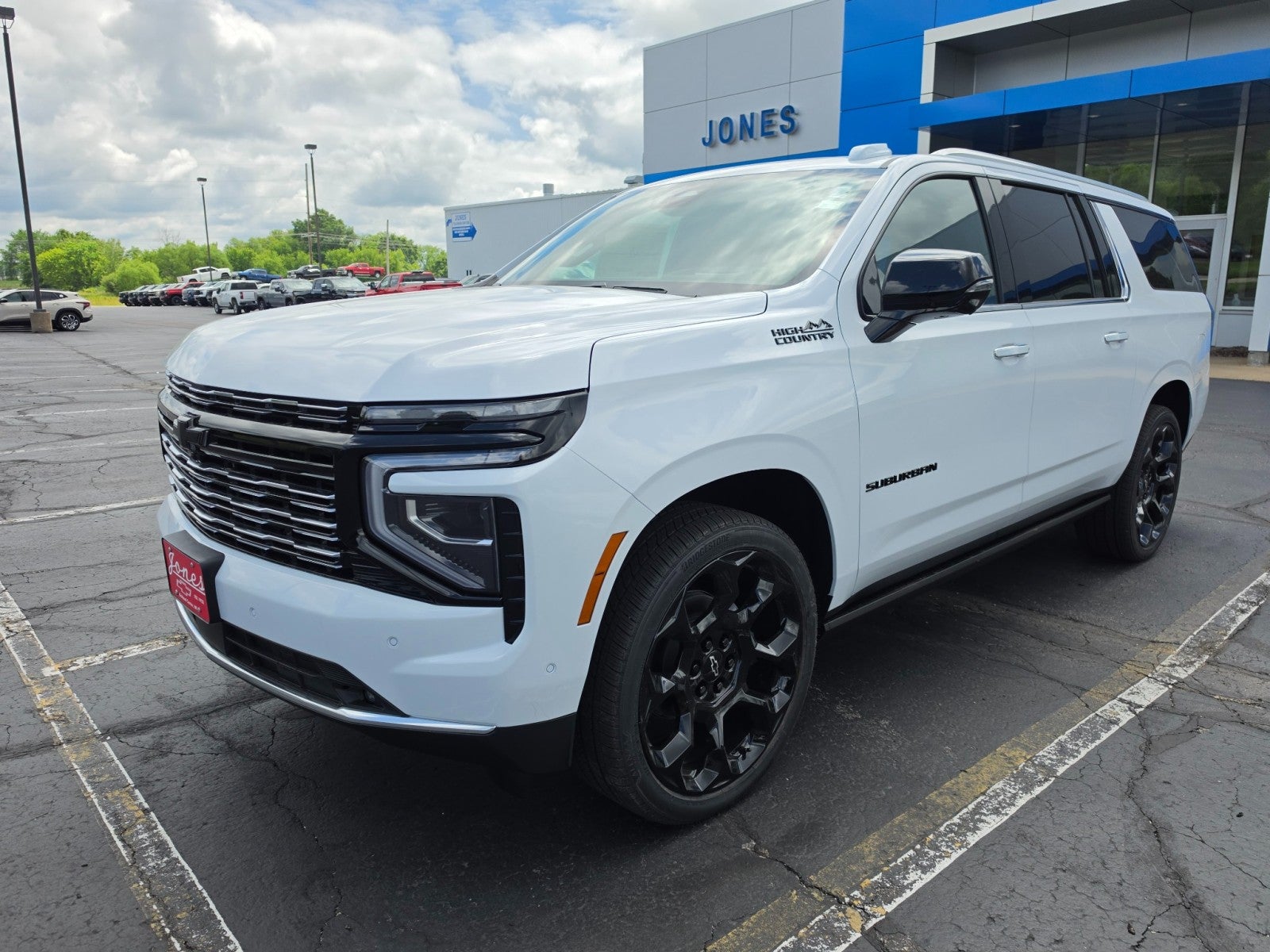 2026 Chevrolet Suburban High Country in Polar White Tricoat — front three-quarter view
